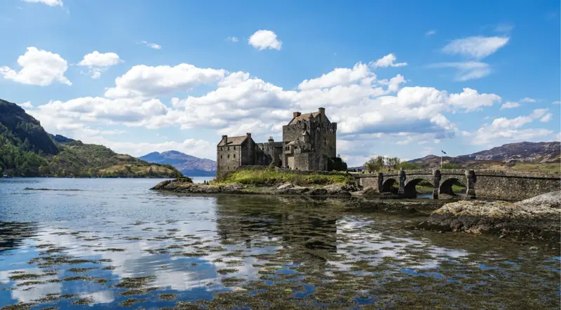 Eilean Donan Castle and its bridge on a sea loch on the road to the Isle of Skye